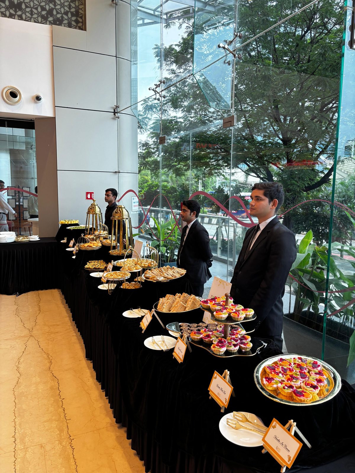 Celebrations World catering spread with service staff at a Mumbai corporate event